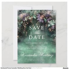 save the date card with flowers and sparkles on green watercolor paper, in front of a marble background