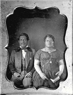 an old black and white photo of two people