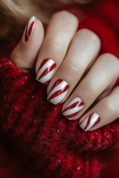 14 Modern Twists on Candy Cane Nails for a Fresh Festive Look Red Christmas Nails Candy Canes, Short Candy Cane Nails, Simple Candy Cane Nails, Red Short Christmas Nails, Candy Cane Nails Acrylic, Candy Cane Nails Short, Christmas Nails Sns, Red French Tip Christmas Nails, Christmas Cat Eye Nails