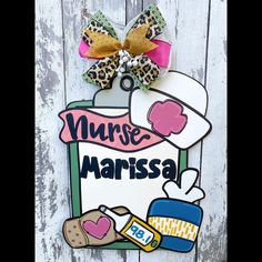 a sign that says nurse marissa on it with a bow hanging from the front