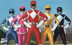 four men in colorful power rangers costumes standing next to each other