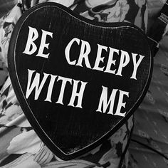 a heart shaped sign that says be creepy with me