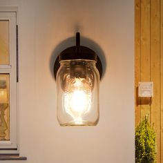 A simple clear glass jar hangs from a hooked arm to create this modest wall sconce. It features a steel holder and glass jar shades provides the functions of illumination and decoration. LNC Aries 6.7-in 1-Light Oil-Rubbed Bronze LED Traditional Vanity Light | AAZQIRLWS297956 Fireplace Hallway, Farmhouse Style Lighting Fixtures, Bathroom Wall Lighting, Bulb Lights, Farmhouse Style Lighting, Ceiling Fan Bathroom, Vanity Light Bar, Traditional Vanity, Kitchen Wall Lights