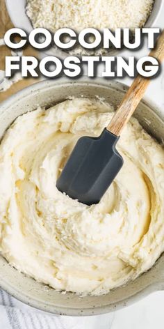 a bowl filled with coconut frosting and a spatula in the top right hand corner