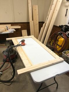 a workbench with tools and wooden planks