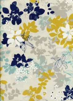 a blue and yellow flowered fabric with white flowers on the bottom half of it