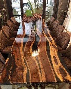 a large wooden table with chairs around it