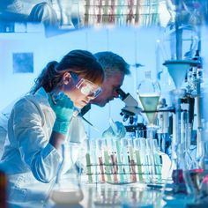 two people working in a lab with test tubes