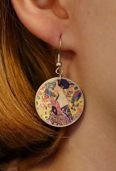 "Lady With A Fan - Gustav Klimt Show your love for the fine arts with our unique handmade earrings. You can wear these enchanting accessories at any given time and occasion to show others you're just as beautiful the painting. ✷ HANDMADE ✷  Handmade with love and care with high-quality wood and metal. Handcrafted in Finland with locally bought materials. ✷ Weatherproof ✷  The earrings have been coated with a weatherproof coating spray. No need to worry about rain!  ✷ Allergy-friendly ✷  All of our earrings are made with nickel tested / nickel free materials to insure that everyone's ears are safe wearing our earrings.  ✷ A Great Gift for Art Lovers ✷  You can also give our earrings to friends, family members, or art lovers on occasions such as birthday, mother's day, Christmas, anniversary Artistic Dangle Jewelry For Gifts, Artistic Dangle Jewelry As Gift, Artistic Design Dangle Jewelry Gift, Artisan Hand Painted Earrings For Gift, Artisan Earrings With Artistic Design As A Gift, Artisan Earrings With Artistic Design For Gift, Artsy Handmade Earrings As A Gift, Artisan Earrings With Artistic Design, Handmade Artsy Earrings As Gift