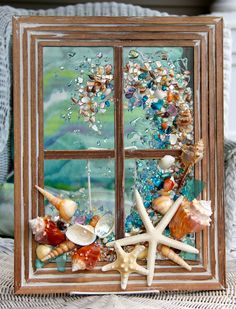 a window with shells and seashells in it