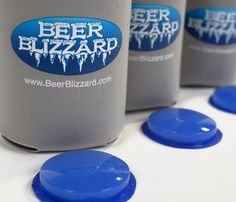 four beer cans with blue caps sitting next to each other