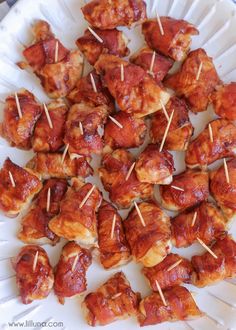 chicken bites with toothpicks on a paper plate