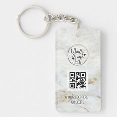 a white marble keychain with a qr code printed on the front and back