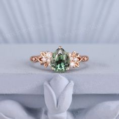 Vintage Green Sapphire Engagement Ring Delicate Pear Wedding Ring Gold Moissanite Inspire Leaf Unique Handmade Anniversary Gift for Her PRODUCT SUMMARY Metal Type: yellow, white or rose solid 10K/14K or 18K gold. Size: All sizes are available, contact me if they do not contain the size you want in the drop-down menu. ☪☪Engagement ring ⚜Center Stone - lab grown olive green sapphire Cut - pear Size - 6x8mm,about 1.3 ct ⚜Side Stone - Moissanite or diamond Cut - Round Weight - 0.12ct Clarity - SI-VS Frog Engagement Ring, Pear-shaped Moissanite Wedding Ring, Pear-shaped Fine Jewelry For Weddings, Green Pear-shaped Diamond Wedding Ring, Moissanite Teardrop Diamond Ring For Wedding, Teardrop Moissanite Diamond Ring For Wedding, Pear-shaped Moissanite Wedding Jewelry, Wedding Teardrop Ring With May Birthstone, Teardrop May Birthstone Wedding Ring