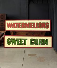 two signs that say watermelons and sweet corn