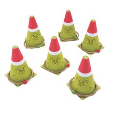 six green and red cones with faces on them