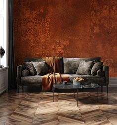 a living room with a couch, coffee table and large wallpapered walls in the background