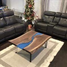 a living room with two couches and a coffee table in it's center