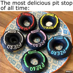 four donuts with different numbers on them sitting on a plate that says, the most delicious pit stop of all time