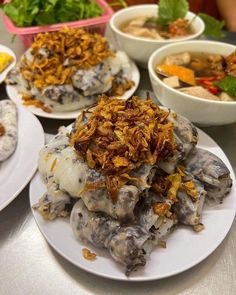 several plates with food on them sitting on a table