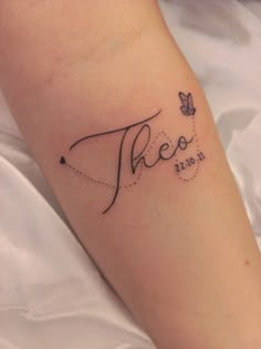 there is a tattoo on the leg of a woman that reads,'this is 2012 in cursive writing