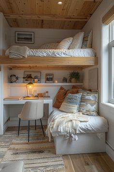 a bedroom with bunk beds and desk in it