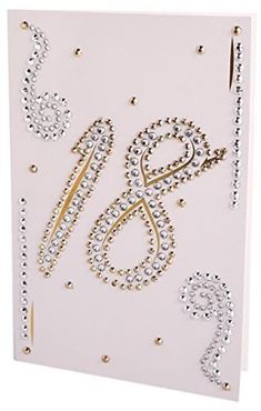 a white card with gold numbers and beads on the front, which reads happy new year