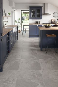 Navy blue kitchen with natural wood  tops and stone floor tiles Grey Marble Floor Kitchen, Kitchen Grey Floor Tiles, Grey Kitchen Floor Tiles, Grey Marble Floor, Marble Floor Kitchen, Grey Kitchen Floor, Orchard House, Grey Floor Tiles