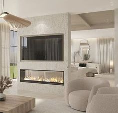 a modern living room with a fireplace and couches in front of a large window