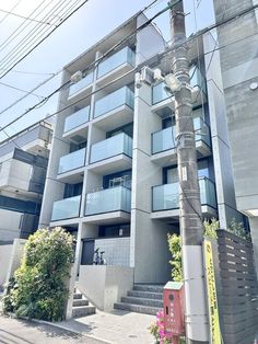 an apartment building on the corner of a street