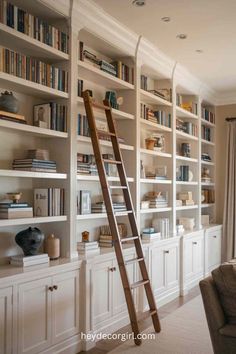 the ladder is leaning against the bookshelves in the living room, which also has built - in shelving