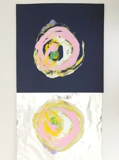 two paintings with different colors and shapes on paper