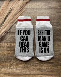 two pairs of socks that say if you can read this, bring me a cup of tea