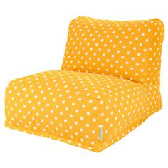 a yellow and white polka dot print chair with the seat cushion folded down to show the back