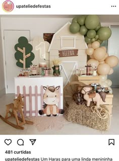 a baby's first birthday party with balloons and farm animals