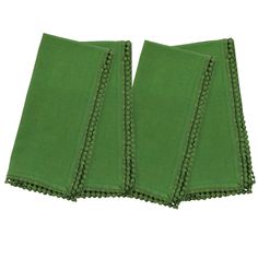 two green napkins with scalloped edges on a white background, one folded and the other closed