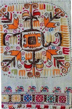 an embroidered piece with colorful designs on it