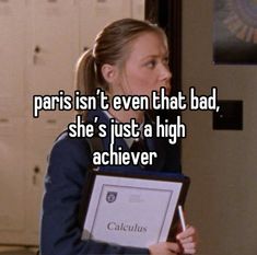 a woman holding a clipboard with the caption paris isn't even that bad, she's just a high achiever