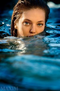 a woman is swimming in the water