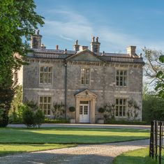 a large stone house with lots of windows