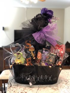 a basket filled with halloween items on top of a table