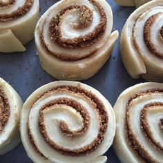 several cinnamon rolls on a baking sheet ready to be baked in the oven or used as an appetizer