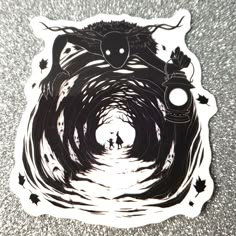 a black and white sticker with an image of a person walking through a tunnel