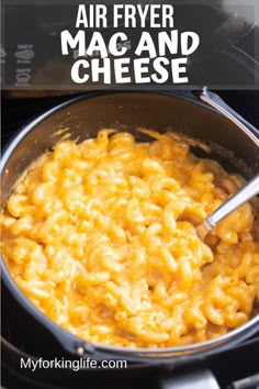 a pot filled with macaroni and cheese on top of an electric stove