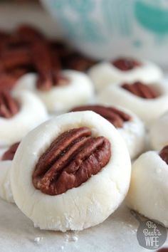 some pecans are sitting on top of each other in the middle of doughnuts