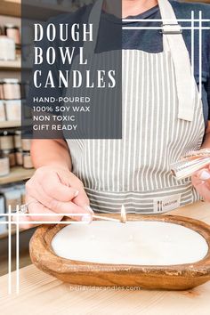 a woman in an apron is making candles with her hands and holding a pair of chopsticks