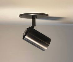 a ceiling light with a cup hanging from it's side