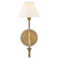 a wall light with a white shade on the side and a gold metal frame,