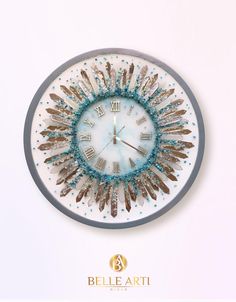 a clock that is on the side of a wall with blue and white beads around it