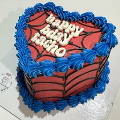 a heart shaped cake with the words happy birthday written on it